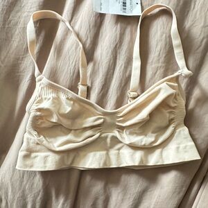 SKIMS Cream Soft Bra with Adjustable Straps and Ruched Cups